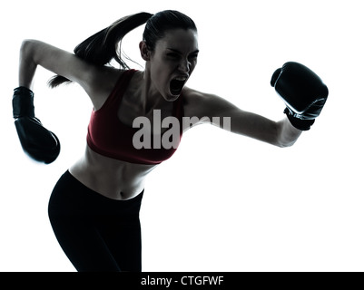 one caucasian woman boxing exercising in silhouette studio  isolated on white background Stock Photo