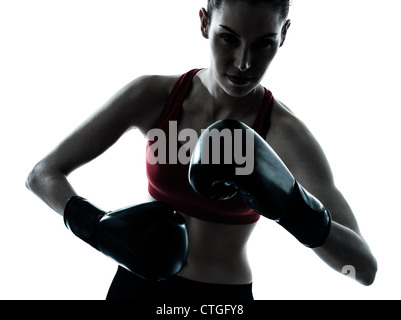 one caucasian woman boxing exercising in silhouette studio  isolated on white background Stock Photo