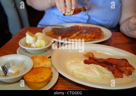 Stuart Florida,Cracker Barrel,restaurant restaurants food dining eating out cafe cafes bistro,interior inside,food,plate,dish,eggs,bacon,corn muffin,p Stock Photo