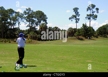 Port St.Saint Lucie Florida,PGA Village,golf course driving range,golfer,practicing,Hispanic Latin Latino ethnic immigrant immigrants minority,man men Stock Photo