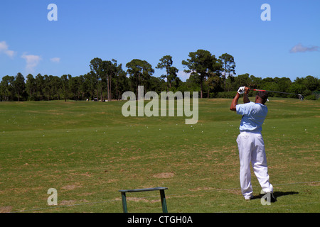 Port St.Saint Lucie Florida,PGA Village,golf course driving range,golfer,practicing,Black Blacks African Africans ethnic minority,man men male adult a Stock Photo