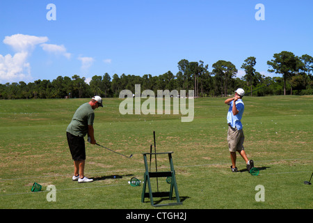Port St.Saint Lucie Florida,PGA Village,golf course driving range,golfer,practicing,man men male adult adults,leisure sport,swing,club,visitors travel Stock Photo