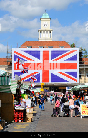 Romford Market Place dominated by big Union Jack flag in place for Queens jubilee and the 2012 Olympic celebrations summers day Stock Photo