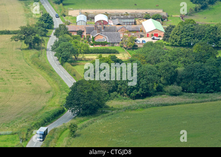 Cheshire Plain aerial view of agriculture landscape looking down on farm buildings & farmhouse rural fertile farmland in Cheshire County England UK Stock Photo