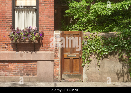 New York, NY - 24 June 2012 Door in the wall, Commerce Street in the West Village Stock Photo