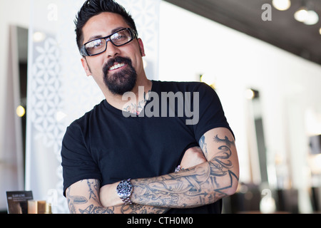 Hispanic man with tattoos Stock Photo
