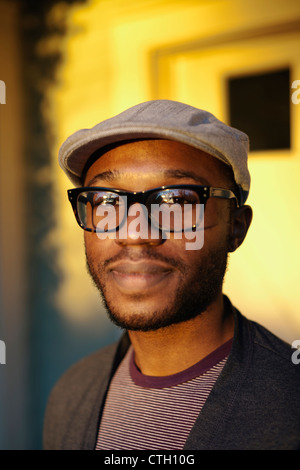Smiling Black man standing outdoors Stock Photo