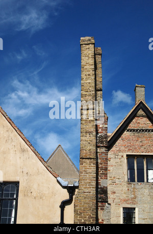 Chimney stacks on old houses with blue sky Stock Photo