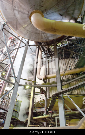 Boilers in action at the Tully Sugar mill, converting cane sugar into raw sugar from June to November at Tully, Queensland Stock Photo