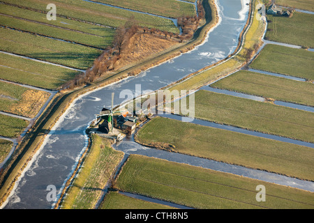 The Netherlands, Kamerik, Windmill in polder. Aerial. Winter. Frost. Stock Photo