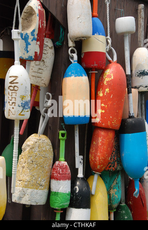 Buoys hanging on a shed wall Stock Photo