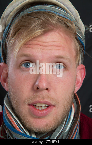 Portrait of a young man with cap doubtful Stock Photo