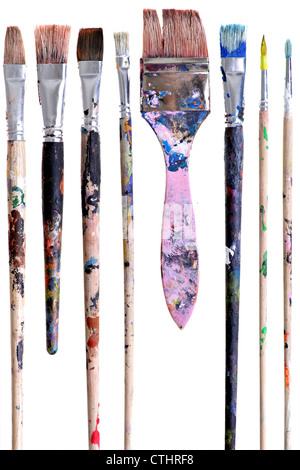 Various dirty paint brushes isolated on white Stock Photo