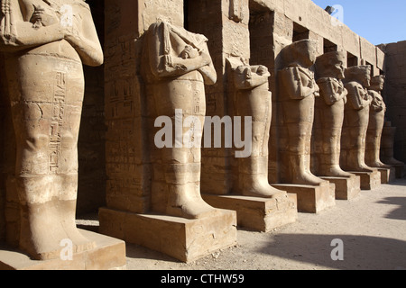 Osirian statues at temple of Pharaoh Ramses III, Karnak Temple Complex, Luxor, Egypt Stock Photo