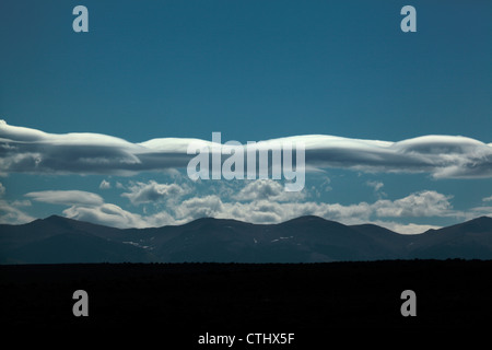 Long lenticular cloud formation over Colorado's Rocky Mountains. Stock Photo