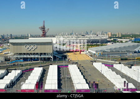 Looking down on Olympic Park aquatic centre & orbit tower left, main stadium middle, water polo right & city of London skyline distant Stratford UK Stock Photo