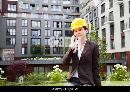 Female construction engineer calling Stock Photo