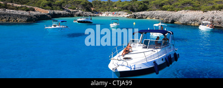 Sailing boat in a small cove at Playa de Son Saura resort, Isle of Menorca, Balearic Isles, Spain, Europe Stock Photo