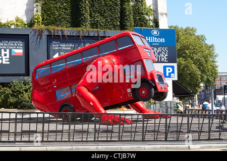 The London Booster, a red london bus that does push ups, by Czech artist David Cerny outside Business Design Centre in Islington Stock Photo