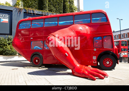 The London Booster, a red london bus that does push ups, by Czech artist David Cerny outside Business Design Centre in Islington Stock Photo