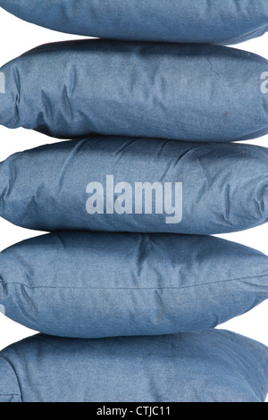 stack of blue denim pillows isolated on white Stock Photo
