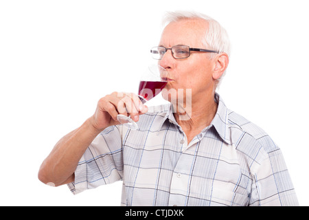 Senior man drinking glass of red wine, isolated on white background. Stock Photo
