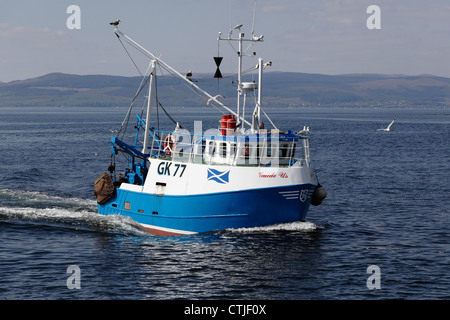 Small fishing boat Guide Us sailing off Largs  in the Firth of Clyde, North Ayrshire, Scotland, UK