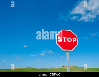 Stop sign over blue sky background Stock Photo