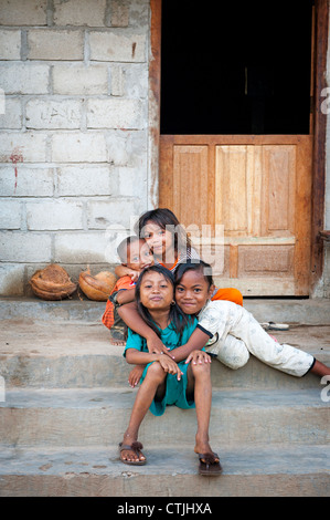 Even though Komodo Island seems like a poor community, the children all seem to enjoy posing for photographs and are happy. Stock Photo