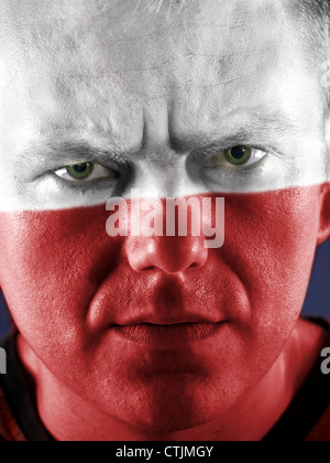 Closeup of young Polish supporter face painted with national flag colors Stock Photo