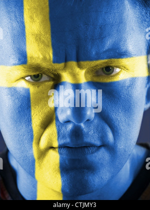 Premium Photo  A person with a yellow and blue face paint that says sweden  on it