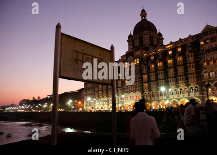 Taj Mahal Hotel  shot during night with a signboard in native language – Hindi reading ‘Mumbai’ Stock Photo