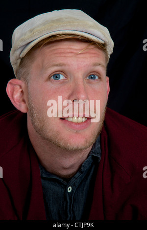Portrait of a young man with cap doubtful Stock Photo