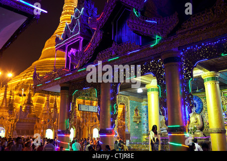 Brightly illuminated by colorful neon lights at night Shwedagon Pagoda, Yangon (Rangoon), Myanmar (Burma) Stock Photo