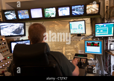 man operating saw machine Stock Photo
