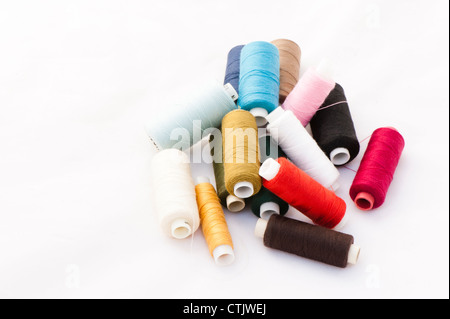 A pile of multi-coloured sewing threads Stock Photo