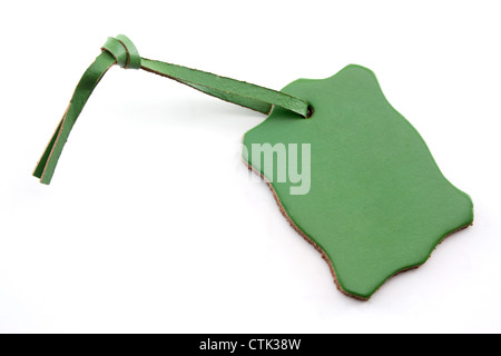 Leather Green Tag on White Background with Copy Space. Stock Photo