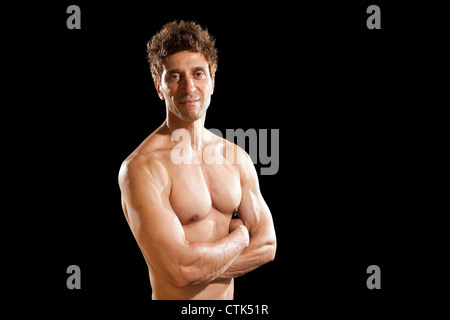 older mens physical health strong muscles 50 year old body fitness body building sport on black background Stock Photo