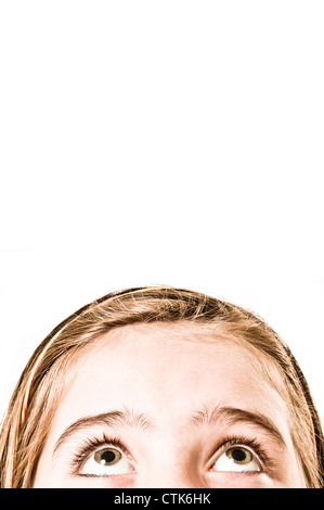 girl looking up worried Stock Photo