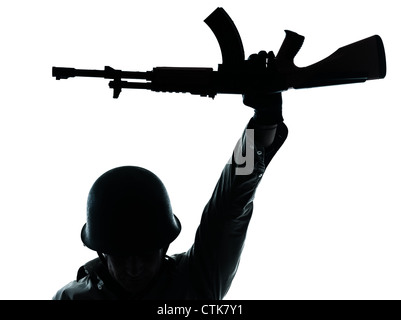 one caucasian revolutionary army soldier man holding ak47 kalachnikov on studio isolated on white background Stock Photo