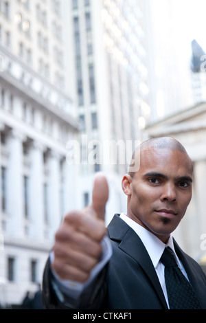 Portrait of a confident businessman showing thumbs up sign Stock Photo