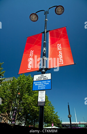 London 2012 Olympics lamp post sign on Wembley Way showing Wembley Park station in background, Wembley, London, England, UK Stock Photo