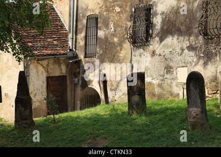 Tombstones at the base of the Clock Tower in Sighisoara, Romania Stock Photo