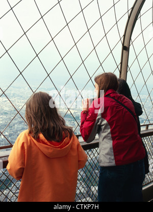 A family of tourists on the viewing deck of the Eiffel Tower, Paris, France. Stock Photo