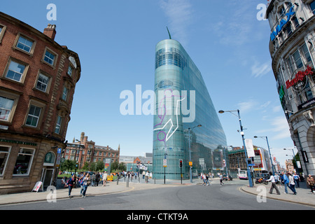 Visitors approach the National Football Museum (Urbis) in Manchester on a clear sunny summer's day. Stock Photo