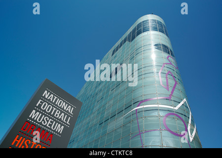The sign signage of the National Football Museum (Urbis) in Manchester on a clear sky sunny summer's day. Stock Photo