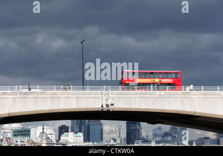 London Bus going over a bridge Stock Photo