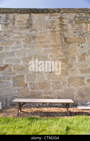 A lonely bench in the courtyard of the Women's Ward, at the Old Idaho State Penitentiary, Boise, Idaho, USA. Stock Photo