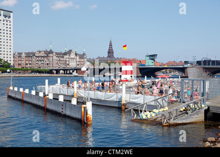 The Copenhagen Harbour Bath at Islands Brygge in the inner harbour of Copenhagen, Denmark, on a warm and sunny summer day. Public urban beach. Stock Photo