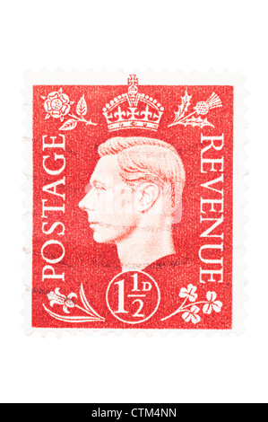 A King George VI one and a half penny red 1 1/2d postage stamp on a white background Stock Photo